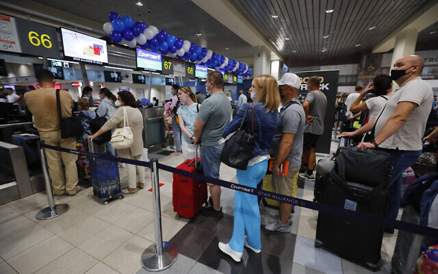 Russian tourists gather at the Egyptair check-in desk at the Domodedovo International Airport outside Moscow, Russia, August 9, 2021. (AP Photo/Alexander Zemlianichenko Jr) Russian tourists gather at the Egyptair check-in desk at the Domodedovo International Airport outside Moscow, Russia, August 9, 2021. (AP Photo/Alexander Zemlianichenko Jr)
