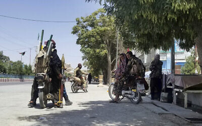Taliban fighters patrol inside the city of Ghazni, southwest of Kabul, Afghanistan, on Thursday, August 12, 2021. (AP Photo/Gulabuddin Amiri) Taliban fighters patrol inside the city of Ghazni, southwest of Kabul, Afghanistan, on Thursday, August 12, 2021. (AP Photo/Gulabuddin Amiri)