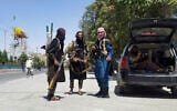Taliban fighters pose for a photo as they patrol inside the city of Ghazni, southwest of Kabul, Afghanistan, Aug. 12, 2021 (AP Photo/Gulabuddin Amiri)