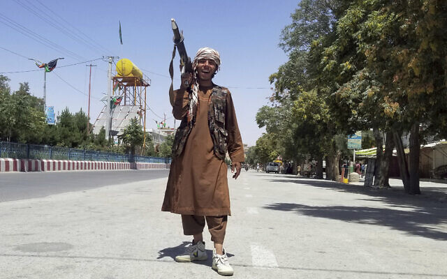 A Taliban fighter poses for a photo as he patrols inside the city of Ghazni, southwest of Kabul, Afghanistan, August 12, 2021. (Gulabuddin Amiri/AP) A Taliban fighter poses for a photo as he patrols inside the city of Ghazni, southwest of Kabul, Afghanistan, August 12, 2021. (Gulabuddin Amiri/AP)