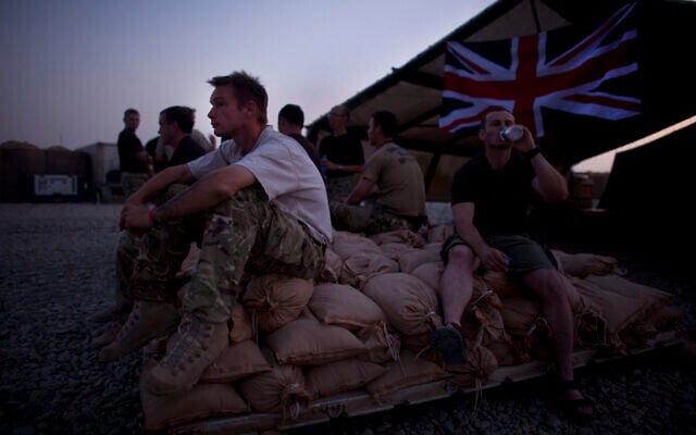 In this August 22, 2011 file photo, British soldier Lance Cpl. Justin Reeve, of Dorset, England, of the Royal Corps of Signals, rests after a day spent establishing coms, at Combat Outpost Ouellette, Helmand province, southern Afghanistan. (AP/Brennan Linsley, file) In this August 22, 2011 file photo, British soldier Lance Cpl. Justin Reeve, of Dorset, England, of the Royal Corps of Signals, rests after a day spent establishing coms, at Combat Outpost Ouellette, Helmand province, southern Afghanistan. (AP/Brennan Linsley, file)