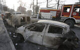 Charred cars are pictured after a fire near the village of Achlouf, in the Kabyle region, east of Algiers, August 13, 2021. (Toufik Doudou/AP)