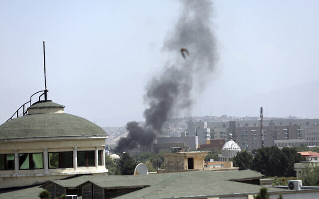 Smoke rises next to the US Embassy in Kabul, Afghanistan, Aug. 15, 2021 (AP Photo/Rahmat Gul)