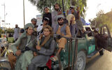 Taliban fighters patrol inside the city of Kandahar province southwest, of Afghanistan, August 15, 2021. (Sidiqullah Khan/AP)
