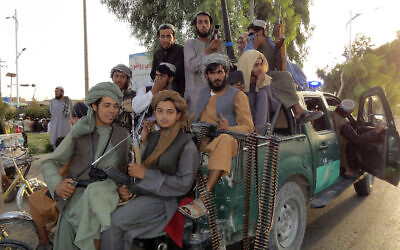 Taliban fighters patrol inside the city of Kandahar province southwest, of Afghanistan, August 15, 2021. (Sidiqullah Khan/AP)