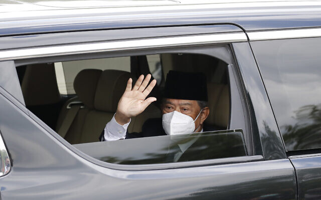 Embattled Malaysian Prime Minister Muhyiddin Yassin waves from a car while entering the National Palace to meet with the King in Kuala Lumpur, Malaysia, Aug. 16, 2021 (AP Photo/FL Wong) Embattled Malaysian Prime Minister Muhyiddin Yassin waves from a car while entering the National Palace to meet with the King in Kuala Lumpur, Malaysia, Aug. 16, 2021 (AP Photo/FL Wong)