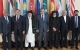In this July 12, 2018 file photo, Russian Foreign Minister Sergey Lavrov, center, poses for a photo with the participants of the conference on Afghanistan bringing together representatives of the Afghan authorities and the Taliban in Moscow, Russia. (AP/Pavel Golovkin, File)