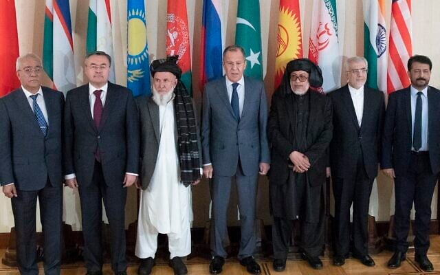 In this July 12, 2018 file photo, Russian Foreign Minister Sergey Lavrov, center, poses for a photo with the participants of the conference on Afghanistan bringing together representatives of the Afghan authorities and the Taliban in Moscow, Russia. (AP/Pavel Golovkin, File) In this July 12, 2018 file photo, Russian Foreign Minister Sergey Lavrov, center, poses for a photo with the participants of the conference on Afghanistan bringing together representatives of the Afghan authorities and the Taliban in Moscow, Russia. (AP/Pavel Golovkin, File)