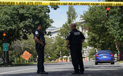 Law enforcement officials surround an area of Pennsylvania Avenue area near the US Capitol and a Library of Congress building in Washington, on August 19, 2021, as they investigate a report of a pickup truck containing an explosive device. (AP Photo/Alex Brandon)