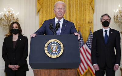 US President Joe Biden speaks about the evacuation of American citizens, their families, SIV applicants and vulnerable Afghans in the East Room of the White House, on August 20, 2021, in Washington, DC. Vice President Kamala Harris, left, and Secretary of State Antony Blinken listen. (AP Photo/Manuel Balce Ceneta)