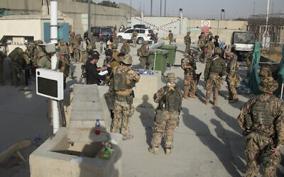 In this photo provided by the Ministry of Defence, members of the British and US military engage in the evacuation of people out of Kabul, Afghanistan, on August 20, 2021. (Ministry of Defence via AP)