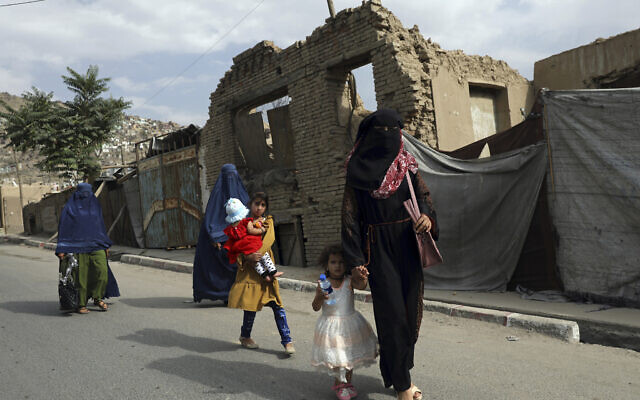 Afghan women in burqas walk on a street in Kabul, Afghanistan, Sunday, Aug. 22, 2021. (AP Photo/Rahmat Gul) Afghan women in burqas walk on a street in Kabul, Afghanistan, Sunday, Aug. 22, 2021. (AP Photo/Rahmat Gul)