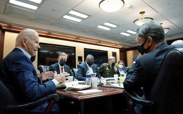 In this image released by The White House, US President Joe Biden speaks with his national security team during a briefing on the situation in Afghanistan on Aug. 22, 2021, in the White House Situation Room in Washington. (Erin Scott/The White House via AP) In this image released by The White House, US President Joe Biden speaks with his national security team during a briefing on the situation in Afghanistan on Aug. 22, 2021, in the White House Situation Room in Washington. (Erin Scott/The White House via AP)