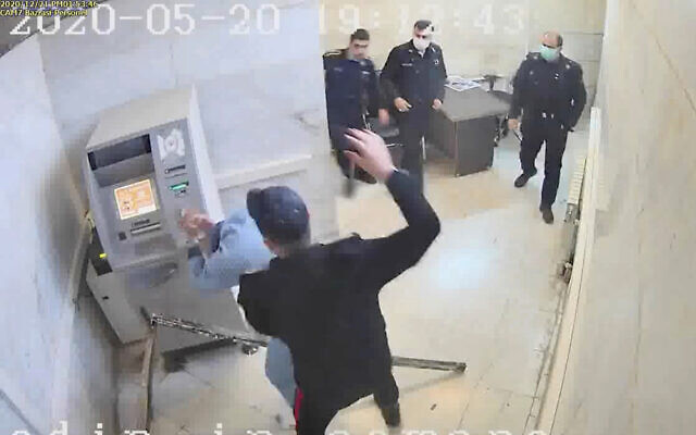In this undated frame grab taken from video shared with The Associated Press by a self-identified hacker group called "The Justice of Ali," a guard beats a prisoner, at Evin prison in Tehran, Iran. (The Justice of Ali via AP) In this undated frame grab taken from video shared with The Associated Press by a self-identified hacker group called "The Justice of Ali," a guard beats a prisoner, at Evin prison in Tehran, Iran. (The Justice of Ali via AP)