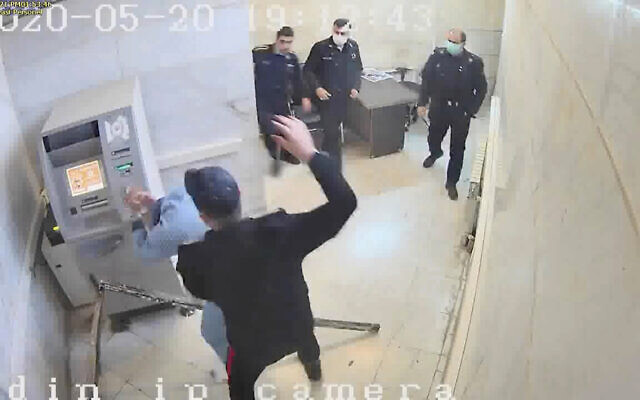 In this undated frame grab taken from video shared with The Associated Press by a self-identified hacker group called "The Justice of Ali," a guard beats a prisoner, at Evin prison in Tehran, Iran. The alleged hackers said the release of the footage was an effort to show the grim conditions at the prison, known for holding political prisoners and those with ties abroad who are often used as bargaining chips in negotiations with the West. (The Justice of Ali via AP) In this undated frame grab taken from video shared with The Associated Press by a self-identified hacker group called "The Justice of Ali," a guard beats a prisoner, at Evin prison in Tehran, Iran. The alleged hackers said the release of the footage was an effort to show the grim conditions at the prison, known for holding political prisoners and those with ties abroad who are often used as bargaining chips in negotiations with the West. (The Justice of Ali via AP)