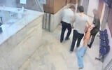 In this undated frame grab taken from video shared with The Associated Press by a self-identified hacker group called "The Justice of Ali," guards drag an emaciated prisoner, at Evin prison in Tehran, Iran. (The Justice of Ali via AP)