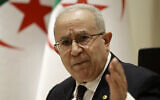 Algerian Foreign Minister Ramtane Lamamra gestures as he reads a statement from the country's president in Algiers on Aug.24, 2021. (AP/Fateh Guidoum)