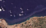 In this satellite photo from Planet Labs Inc., an oil spill is seen stretching off the coast near Baniyas, Syria, August 24, 2021. (Planet Labs Inc. via AP)