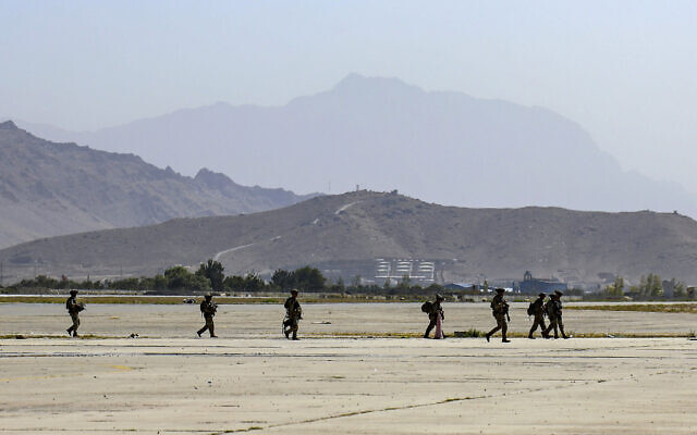 Paratroopers assigned to the 1st Brigade Combat Team, 82nd Airborne Division help facilitate the safe evacuation of U.S. citizens, Special Immigrant Visa applicants, and other at-risk Afghans out of Afghanistan, at Hamid Karzai International Airport, Kabul, Afghanistan, Wednesday, Aug. 25, 2021. (Sgt. Jillian G. Hix/U.S. Army via AP)