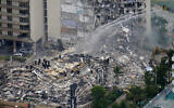 Rescue workers work in the rubble at the Champlain Towers South Condo in Surfside, Florida, June 25, 2021. (AP Photo/Gerald Herbert, File)