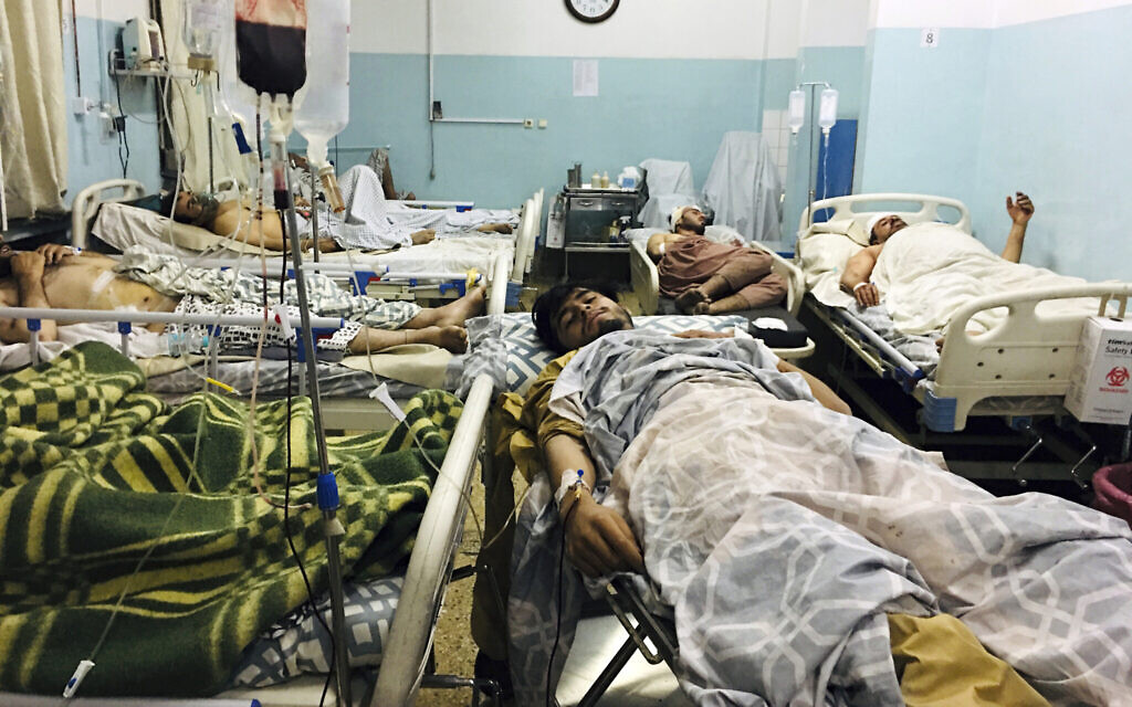 Wounded Afghans lie on a bed at a hospital after a deadly explosion outside the airport in Kabul, Afghanistan, Thursday, Aug. 26, 2021. (AP/Mohammad Asif Khan) Wounded Afghans lie on a bed at a hospital after a deadly explosion outside the airport in Kabul, Afghanistan, Thursday, Aug. 26, 2021. (AP/Mohammad Asif Khan)