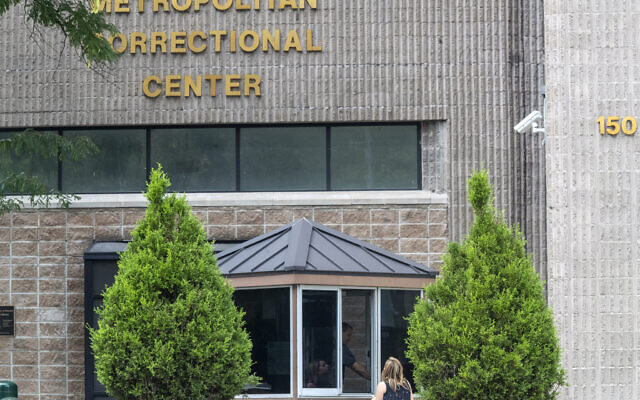 In this August 13, 2019 file photo, an employee checks a visitor outside the Metropolitan Correctional Center in New York. (AP/Mary Altaffer, File) In this August 13, 2019 file photo, an employee checks a visitor outside the Metropolitan Correctional Center in New York. (AP/Mary Altaffer, File)