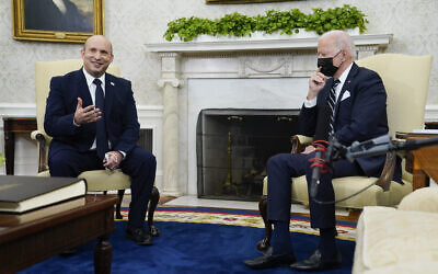 Prime Minister Naftali Bennett meets with US President Joe Biden in the Oval Office of the White House, August 27, 2021, in Washington. (AP Photo/Evan Vucci)