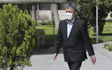 In this photo released by the official website of the office of the Iranian Presidency, then-Minister of Road and Urbanization Mohammad Eslami, walks in the presidency compound, April 7, 2021, in Tehran, Iran. (Iranian Presidency Office via AP)