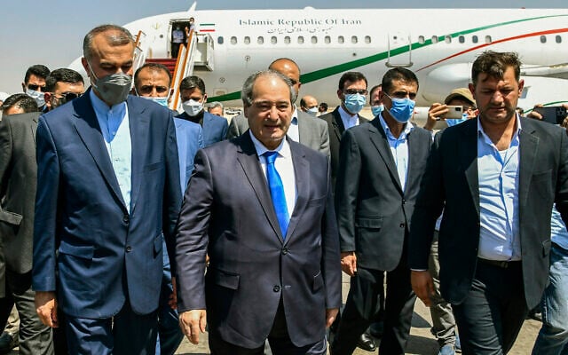 Syria's Foreign Minister Faisal Mekdad, center left, receives Iran's new Foreign Minister Hossein Amir-Abdollahian, left, in Damascus, Syria, August 29, 2021. (SANA via AP) Syria's Foreign Minister Faisal Mekdad, center left, receives Iran's new Foreign Minister Hossein Amir-Abdollahian, left, in Damascus, Syria, August 29, 2021. (SANA via AP)