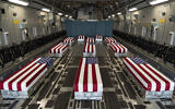 In this image provided by the US Air Force, flag-draped transfer cases line the inside of a transport plane Sunday, Aug. 29, 2021, prior to a dignified transfer at Dover Air Force Base, Del. The fallen service members were killed while supporting non-combat operations in Kabul, Afghanistan. (Jason Minto/US Air Force via AP)