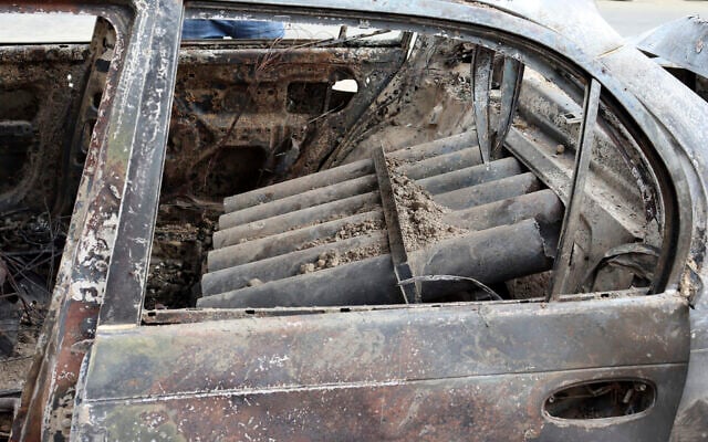 Rocket launcher tubes are seen inside a destroyed vehicle in Kabul, Afghanistan, August 30, 2021. (AP Photo/Khwaja Tawfiq Sediqi)