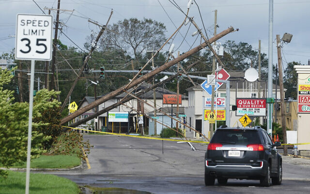Traffic diverts around downed power lines August 30, 2021, in Metairie, Louisiana. (AP Photo/Steve Helber) Traffic diverts around downed power lines August 30, 2021, in Metairie, Louisiana. (AP Photo/Steve Helber)