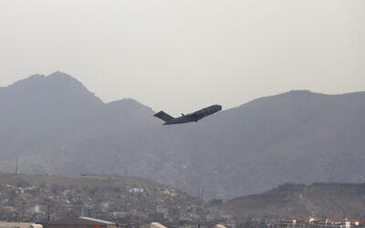 A US military aircraft takes off from the Hamid Karzai International Airport in Kabul, Afghanistan, Monday, Aug. 30, 2021. (AP Photo/Wali Sabawoon)