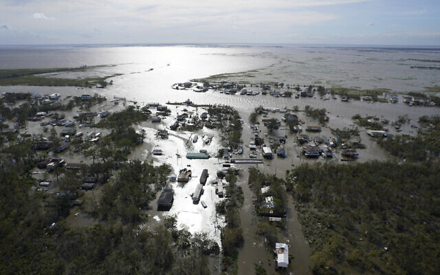 Homes are flooded in the aftermath of Hurricane Ida, August 30, 2021, in Lafitte, Louisiana. (AP Photo/David J. Phillip)