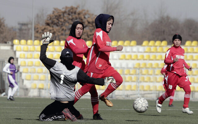 Illustrative: Afghan female soccer players compete in a match at the Afghanistan Football Federation (AFF) stadium in Kabul, on Friday, December 6, 2013. (AP Photo/Rahmat Gul) Illustrative: Afghan female soccer players compete in a match at the Afghanistan Football Federation (AFF) stadium in Kabul, on Friday, December 6, 2013. (AP Photo/Rahmat Gul)