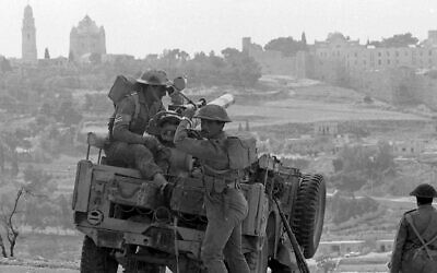 Jordanian troops ready a recoilless anti-tank gun on a jeep, in Jerusalem, May 31, 1967. In the background is the Notre Dame De France Church and Hospital, left, inside the then-Israeli sector of Jerusalem.  (AP Photo)