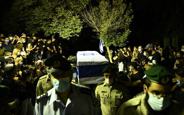 A coffin carrying the body of Border Police officer Barel Hadaria Shmueli at a funeral in Tel Aviv on August 30, 2021. Shmueli died nine days after being shot in the head during riots on the Gaza border. (Police spokesperson) A coffin carrying the body of Border Police officer Barel Hadaria Shmueli at a funeral in Tel Aviv on August 30, 2021. Shmueli died nine days after being shot in the head during riots on the Gaza border. (Police spokesperson)