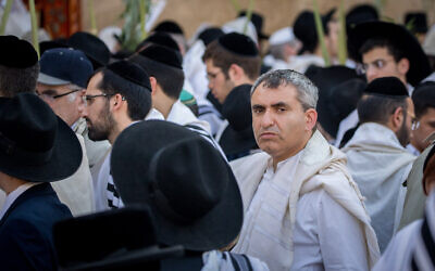 File: Then-Minister of Jerusalem Affairs Ze'ev Elkin attends Sukkot prayers at the Western Wall in Jerusalem, on September 30, 2018. (Yonatan Sindel/Flash90)
