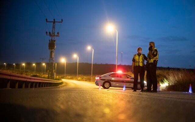Illustrative: Police officers at the entrance to the Emmanuel settlement in the West Bank during a coronavirus lockdown, on September 8, 2020. (Sraya Diamant/Flash90) Illustrative: Police officers at the entrance to the Emmanuel settlement in the West Bank during a coronavirus lockdown, on September 8, 2020. (Sraya Diamant/Flash90)