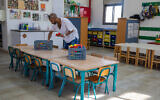 Illustrative: A kindergarten teacher seen at the 'Kobi kindergarten' in Moshav Yashresh, on February 8, 2021. (Yossi Aloni/Flash90)