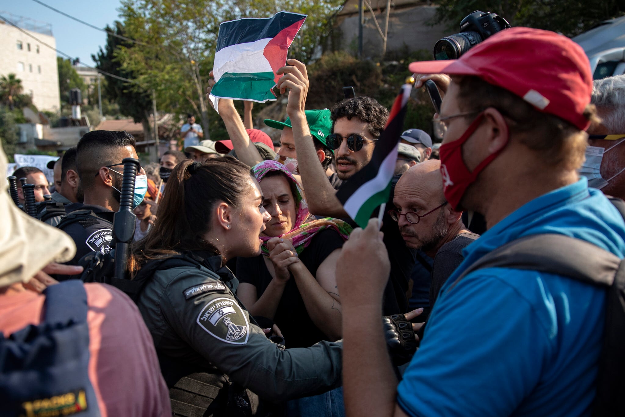 Protesters demonstrate in the East Jerusalem neighborhood of Sheikh Jarrah on July 30, 2021. (Olivier Fitoussi/Flash90) Protesters demonstrate in the East Jerusalem neighborhood of Sheikh Jarrah on July 30, 2021. (Olivier Fitoussi/Flash90)
