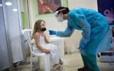 Illustrative: Children take test samples as part of a coronavirus test at Sheba Medical Center in Ramat Gan, August 02, 2021. (Miriam Alster/FLASH90)