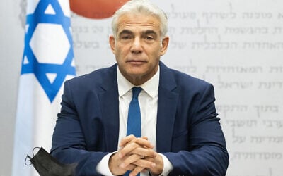 Foreign Minister Yair Lapid speaks during a Yesh Atid faction meeting at the Knesset, on August 2, 2021. (Yonatan Sindel/Flash90)