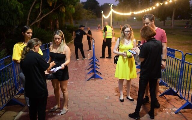 Israelis present their COVID-19 vaccination certificates at the entrance to a concert venue n Tel Aviv on August 7, 2021 in Tel Aviv. (Tomer Neuberg/ Flash90) Israelis present their COVID-19 vaccination certificates at the entrance to a concert venue n Tel Aviv on August 7, 2021 in Tel Aviv. (Tomer Neuberg/ Flash90)