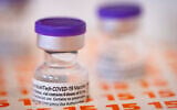 A vial of Pfizer-Biontech COVID-19 vaccine is seen at a Clalit health clinic in Jerusalem on August 8, 2021. (Olivier Fitoussi/Flash90)