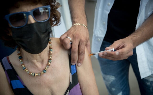 Israelis over 60 years old receive their third dose of the COVID-19 vaccine at a Clalit health care center on August 10, 2021 (Miriam Alster/Flash90) Israelis over 60 years old receive their third dose of the COVID-19 vaccine at a Clalit health care center on August 10, 2021 (Miriam Alster/Flash90)