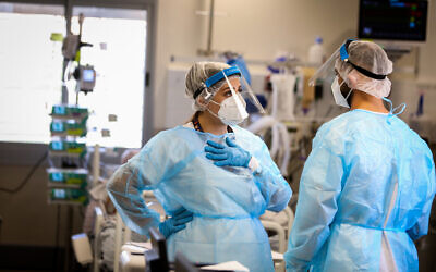 Health workers in the coronavirus ward at Ziv hospital in Safed on August 11, 2021. (David Cohen/Flash90)