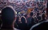 Illustrative image: A live concert by Israeli rock band T-Slam during the annual arts and crafts festival held at Jerusalem's Hutzot Hayotzer Artists' Colony near the Old City walls in Jerusalem, August 10, 2021. (Nati Shohat/Flash90)