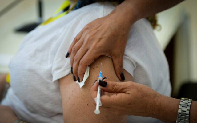 Illustrative: Medical staff receive their third COVID-19 vaccine shots at Meir Medical Center in Kfar Saba, on August 13, 2021. (Avshalom Sassoni/Flash90) Illustrative: Medical staff receive their third COVID-19 vaccine shots at Meir Medical Center in Kfar Saba, on August 13, 2021. (Avshalom Sassoni/Flash90)