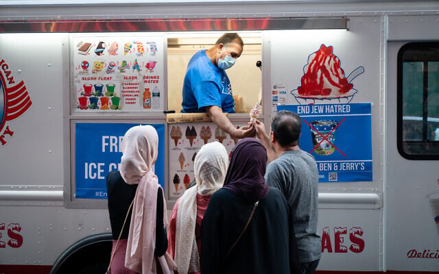 Organizers of a protest against Ben & Jerry's hand out free ice cream in New York City on August 12, 2021. (Luke Tress/Flash90)